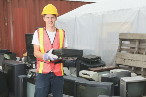 Organized home clearance with movers handling furniture