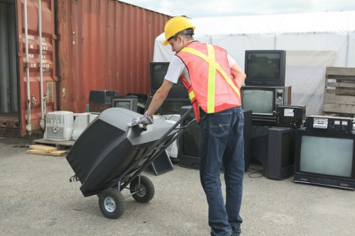 Team efficiently sorting items during a house clearance